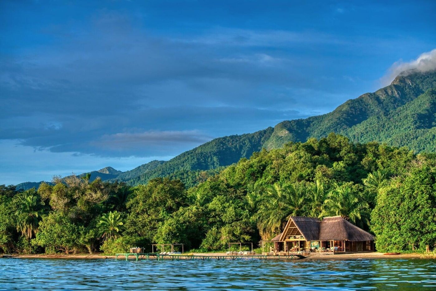 Mbali Mbali Mahale Lodge sits on the beach below forested peaks