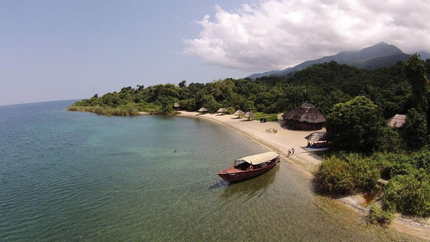 Nkungwe Beach Lodge's thatched cottages line the shore of Lake Tanganyika in Mahale